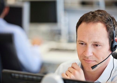 Man in call center on computer