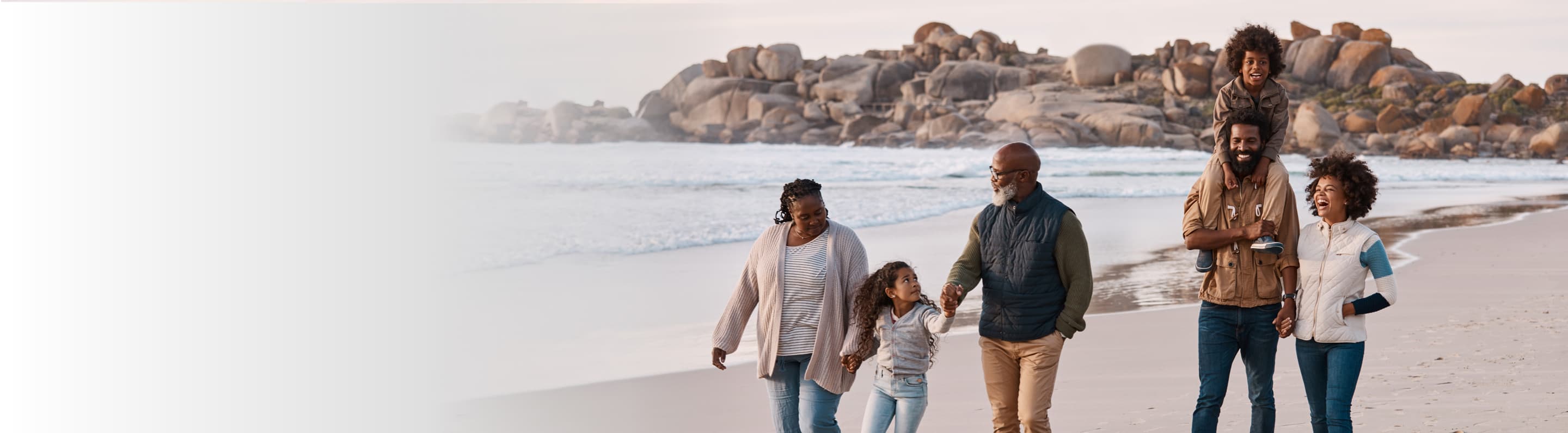 Image showing a family walking on a beach.